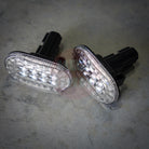 Two LED Jimny indicators on a concrete surface