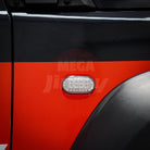 Close-up of a Jimny car door with a red stripe and a visible brand logo.