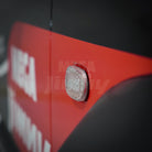 Close-up of a Jimny with a clear LED light on a dark background